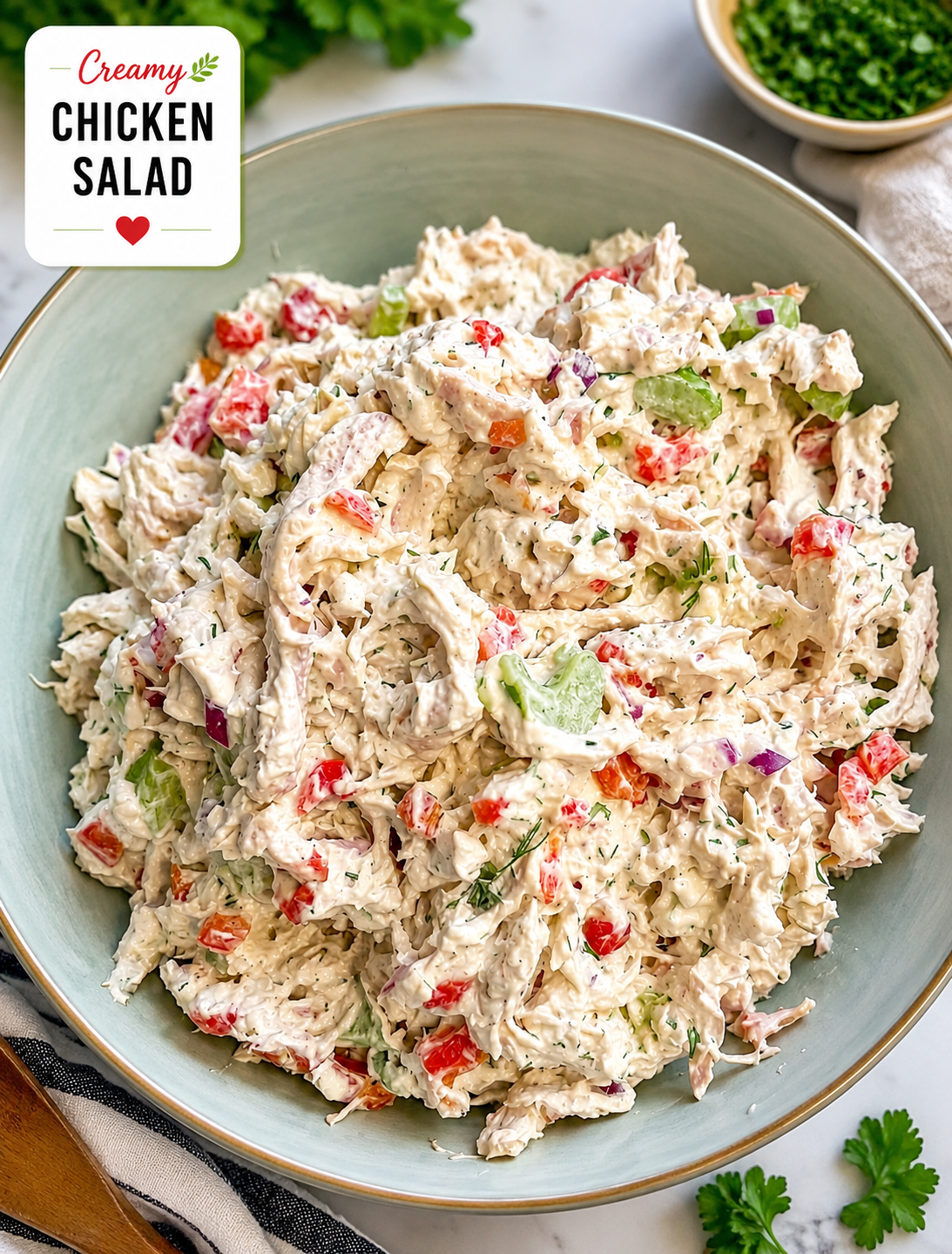 Feta chicken salad with grilled seasoned chicken, feta cheese, cucumber, tomatoes, peppers, olives, fresh herbs, and lemon herb dressing