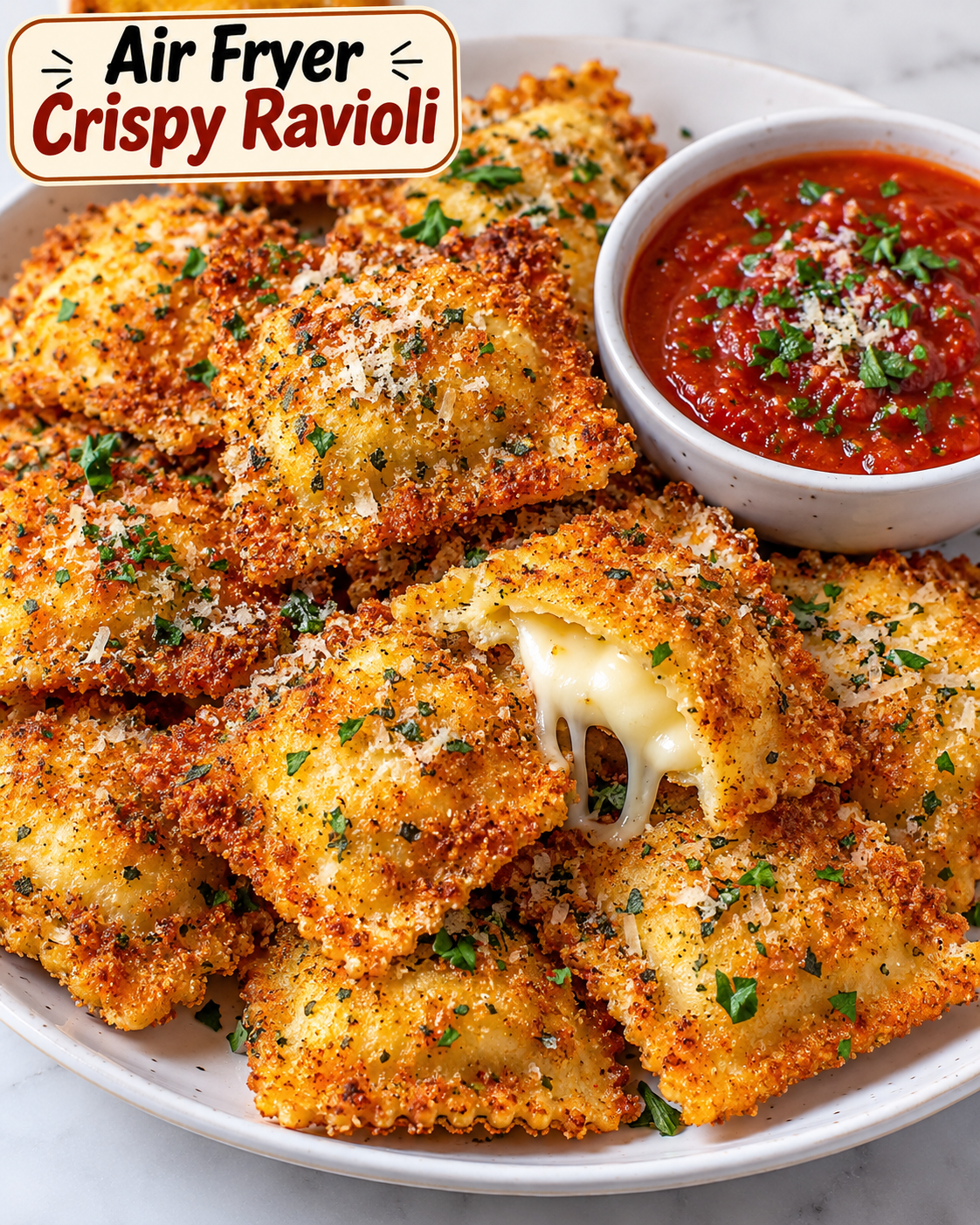 Air Fryer Crispy Ravioli with golden Parmesan breadcrumb coating served with marinara sauce.