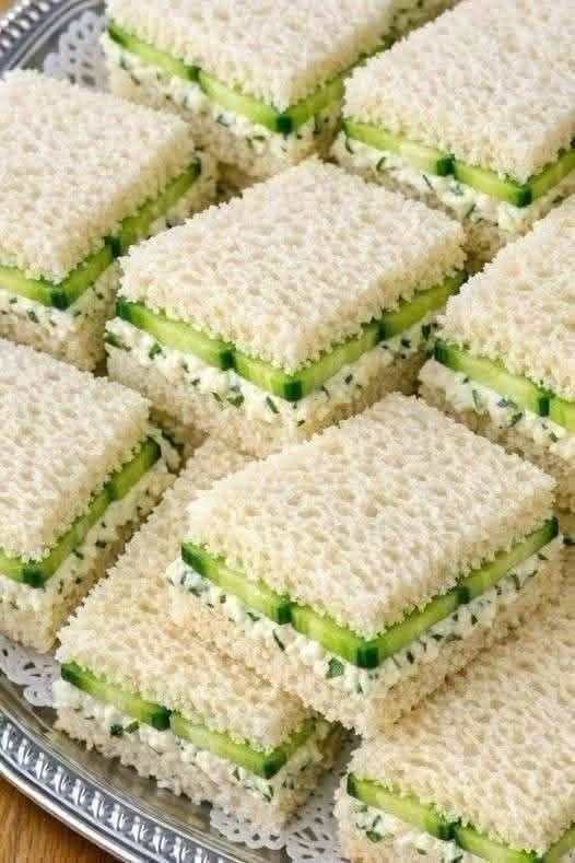 Fresh Cucumber Cream Cheese Tea Sandwiches with soft white bread, thin cucumber slices, and creamy herb filling on a serving platter.