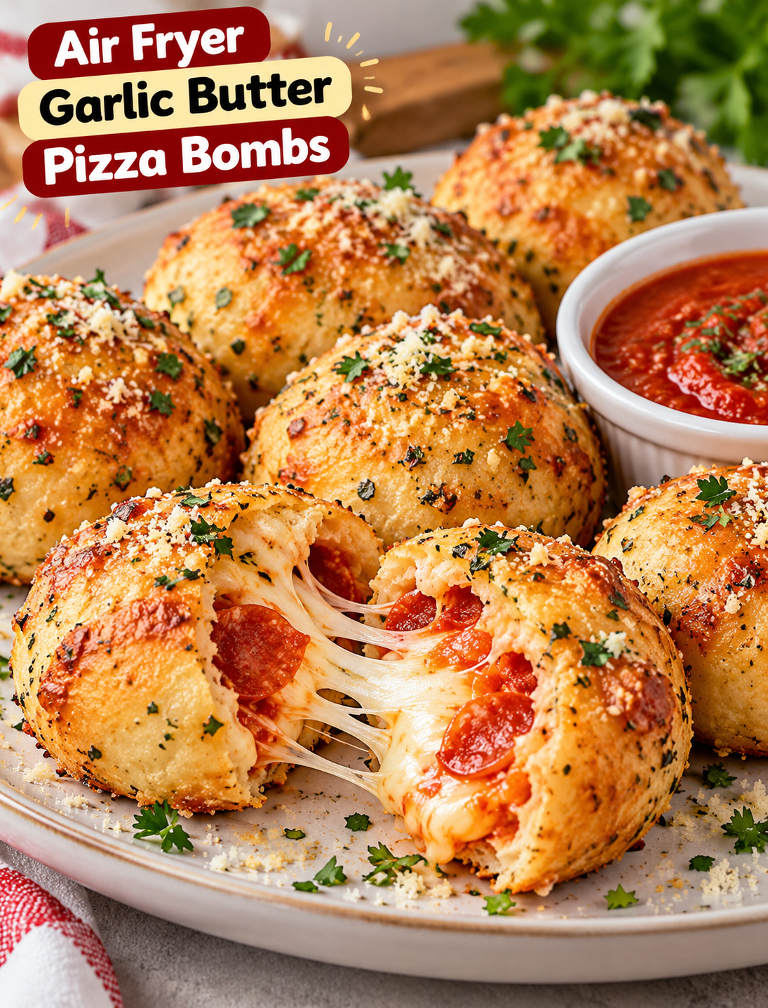 Air fryer garlic butter pizza bombs filled with melted mozzarella and pepperoni, served with marinara dipping sauce.